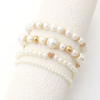 Layered Pearl Bracelet Set on a cream display cushion