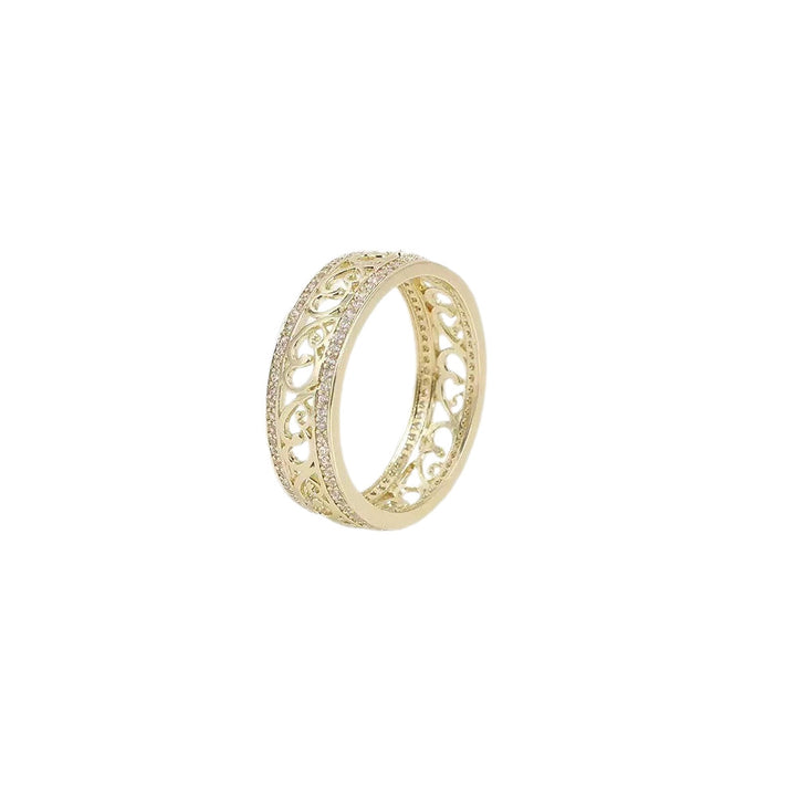 Shiny Hollow Gold-Tone Ring, openwork filigree band with stone-set edges, on a white background